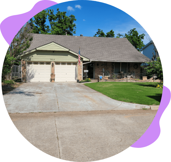 Two-story house with a garage and driveway.